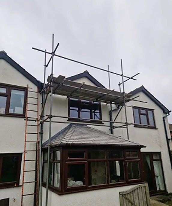 Gutter clearance in progress on a Wirral property