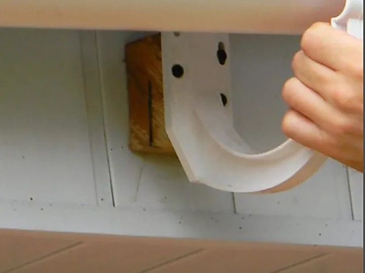 Gutter section being clipped back into its bracket